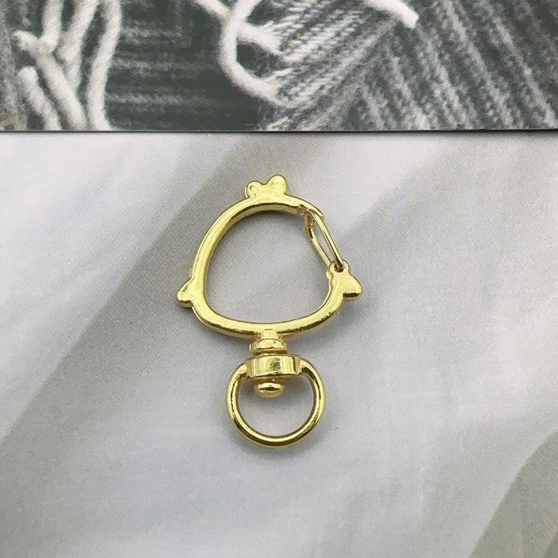 Handmade Metal Rotating Chick Keychain with Christmas Bell and Color Retention.