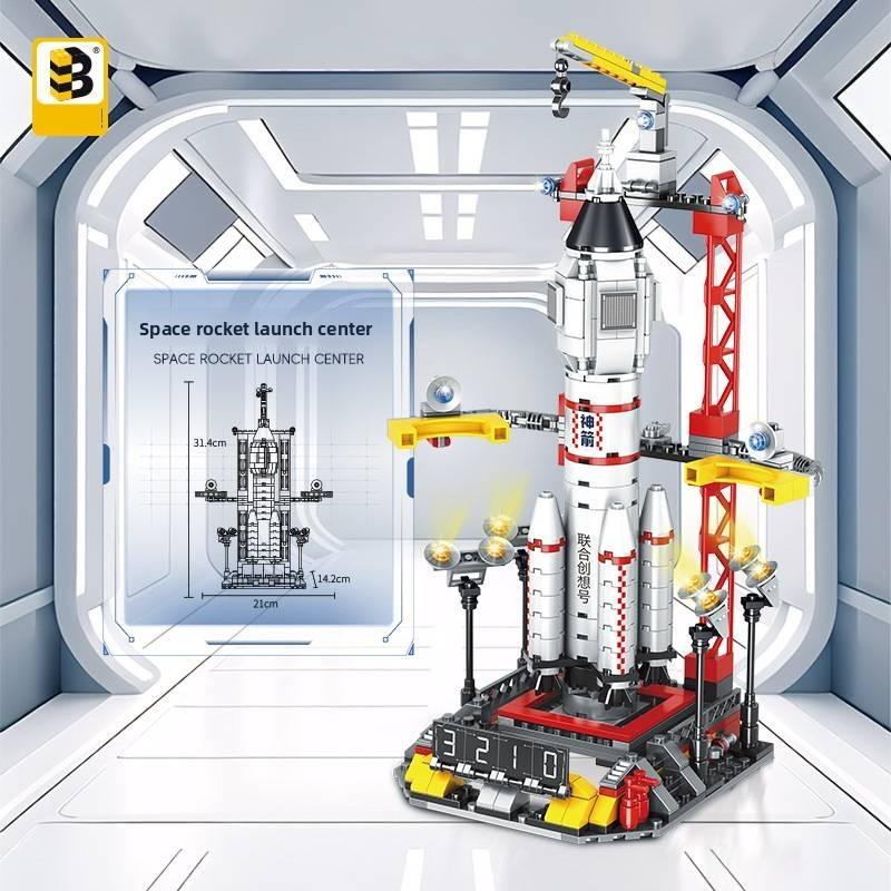 Собирает ракету Шэньчжоу из АБС-пластиковых строительных блоков для ежедневного подарка детям