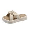 Stepping on shit slippers women's models 2025 summer new models wear versatile thick-bottomed bows with skirts one-word sandals tide