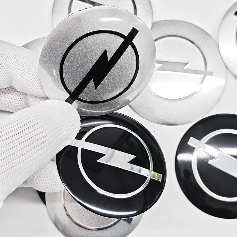AAAYW1 4pcs 56mm 60mm 65mm Car Wheel Center Stickers Hup Emblem For Opel Insignia Astra J F Antara Meriva Zafira H G Corsa Vectra OPC