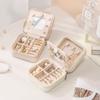 Portable Mini Jewelry Box with Mirror - Anti-Oxidation Travel Case for Rings, Earrings, and Necklaces.
