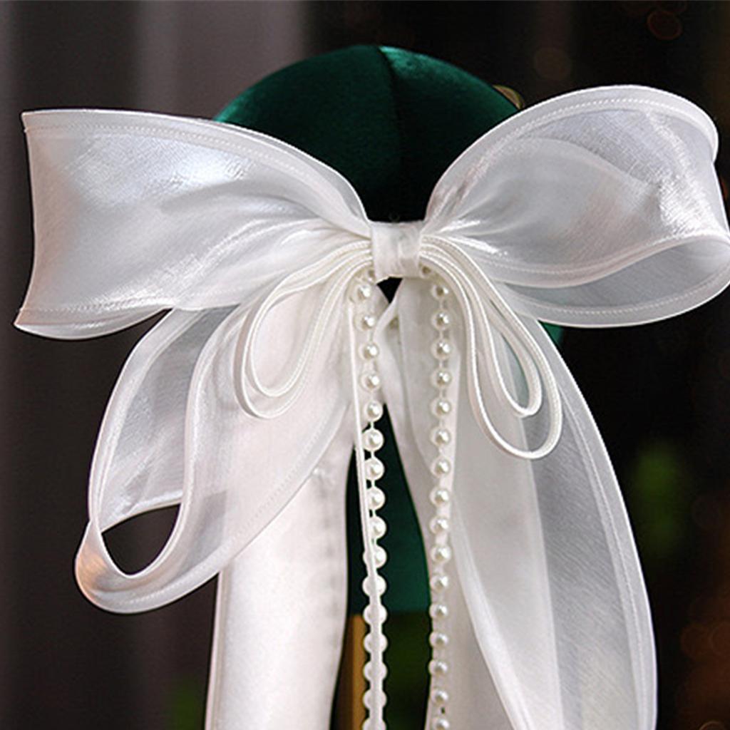 Нежная заколка для волос в виде вуали с бантом и бусинами. Добавьте нотку изысканности в свою прическу с помощью нежной заколки для волос.