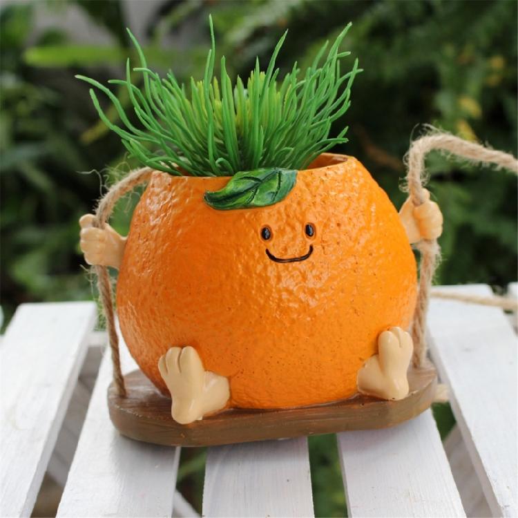 Creative Multifunctional Orange Swing Planter Pot With Swing Feature Suitable for Kids Entertainment and Home Gardening