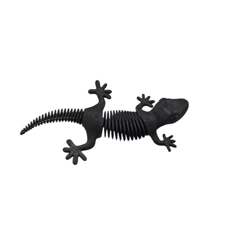 3D-печатная шарнирная игрушка-ящерица на пружине