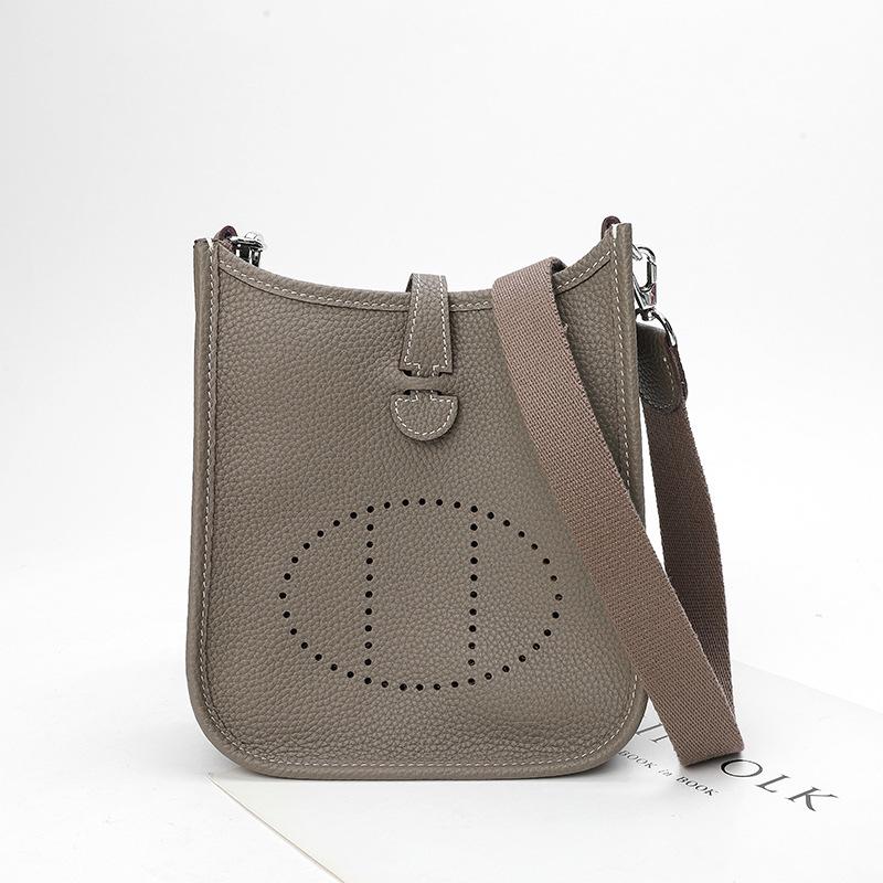 Фабричная оптовая продажа сумка-ведро из натуральной коровьей кожи первого слоя женская сумка с узором личи полый дизайн на одно плечо через плечо полый дизайн