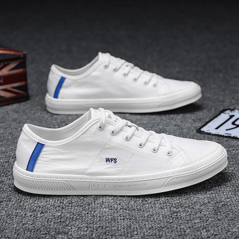 Four Seasons Men's White Canvas Shoes: Korean Style, Casual, Breathable, Lace-up, Low-top Fashion Sneakers.