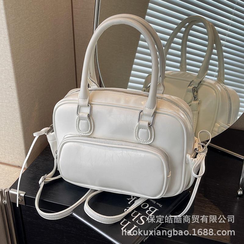 Рюкзак Женский рюкзак 2025 Новый Большая вместимость Нишевый Простой Городской Колледж Колледжный стиль Кожаная школьная сумка