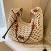 Woven hollow bag women's 2025 new spring and summer seaside vacation travel tote bag beach bag shoulder armpit bag