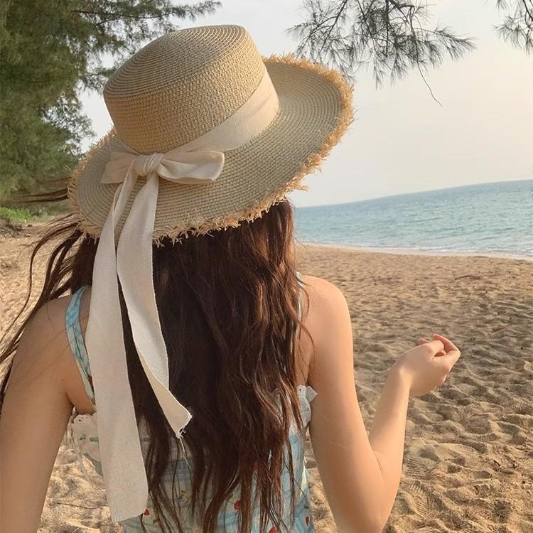 Bow rough edge flat top straw hat women's summer big brim seaside sunshade beach hat vacation style straw woven sunscreen hat