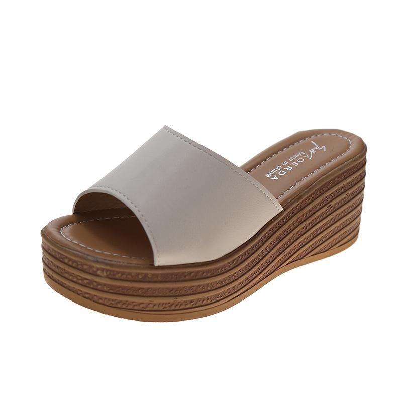 Slope heel cool slippers women's 2025 spring and summer new Korean version thick bottom one word beach women wear muffin bottom slippers