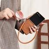 Коричневый кожаный противоударный чехол для Samsung Z Flip7 с ремешком против потери и магнитной застежкой
