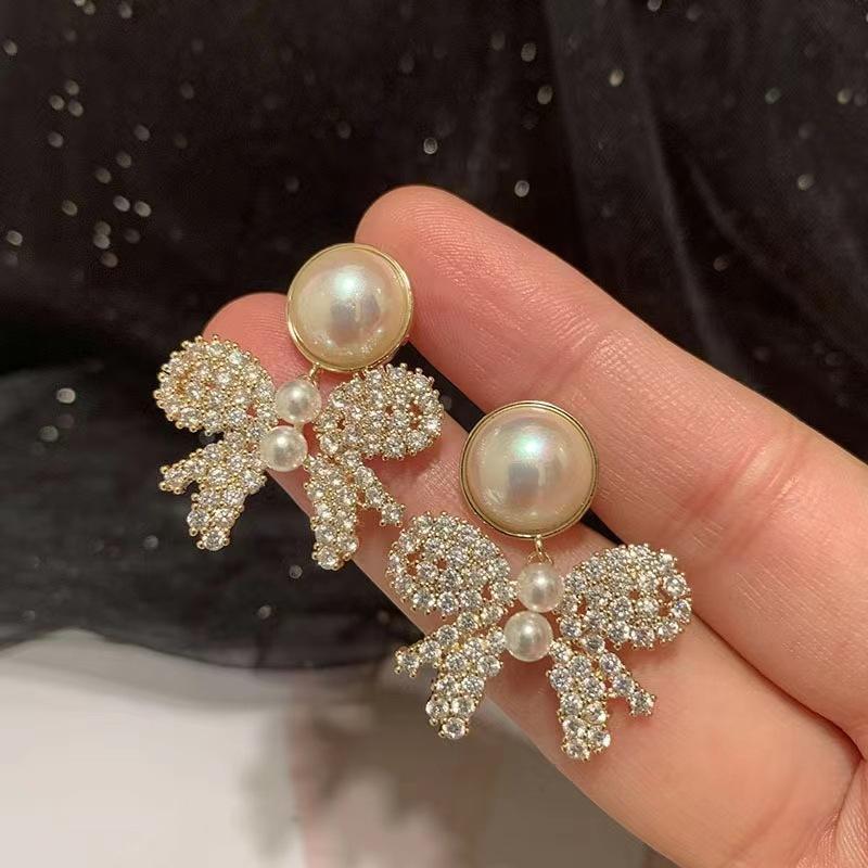 Temperamental Women's Hollow Out Bowknot Zirconia Earrings Dangling Ladies Pearl Earrings Exquisite Generous Ear Jewelry