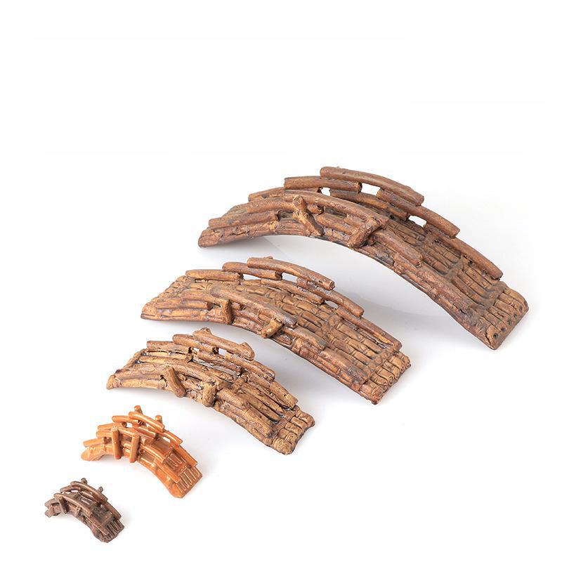 Ландшафтное оформление аквариума: Керамическая горка, водопоглощающие камни, арочный бамбуковый мост, орнамент бонсай