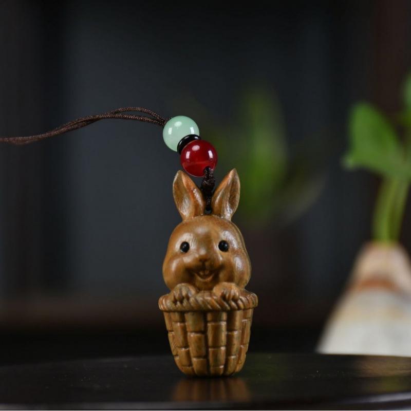 Twelve Zodiac Animal Charms Green Sandalwood Set: Rat, Ox, Tiger, Rabbit, Dragon, Snake, Horse, Sheep, Monkey, Rooster, Dog, Pig.