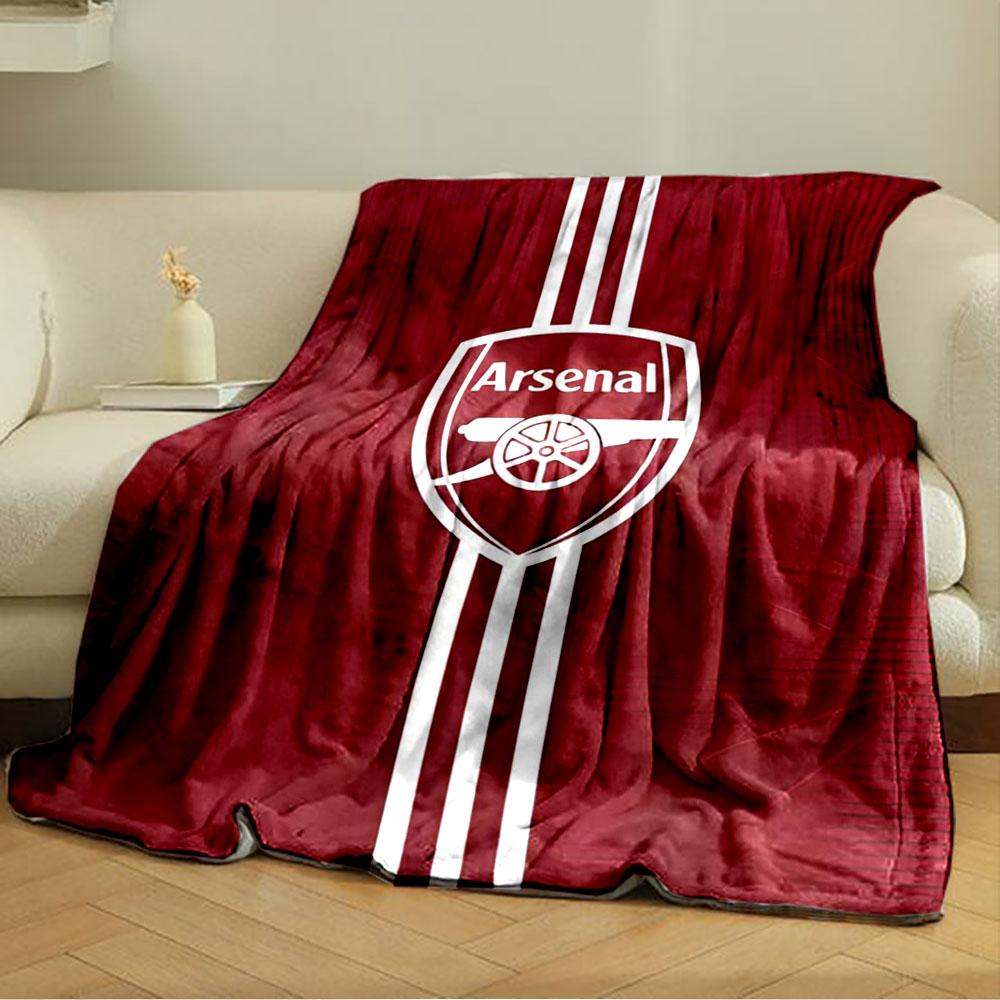 A red background with an Arsenal logo and vertical white stripes. for all seasons blanket lunch break throw gift