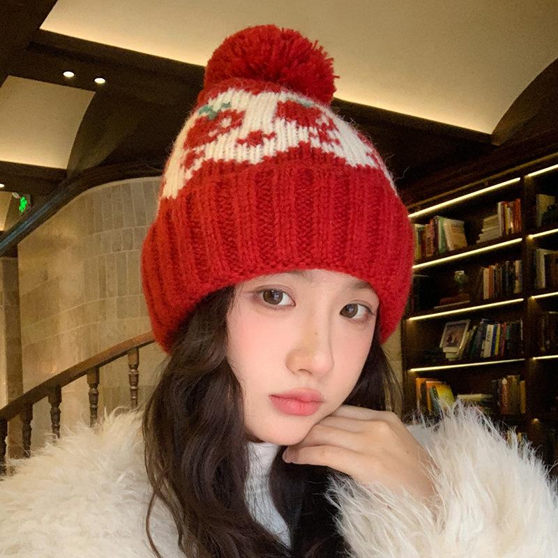 Fair Island wind red strawberry hairball wool hat women's autumn and winter cute cold and warm mountaineering ear protection knitted hat