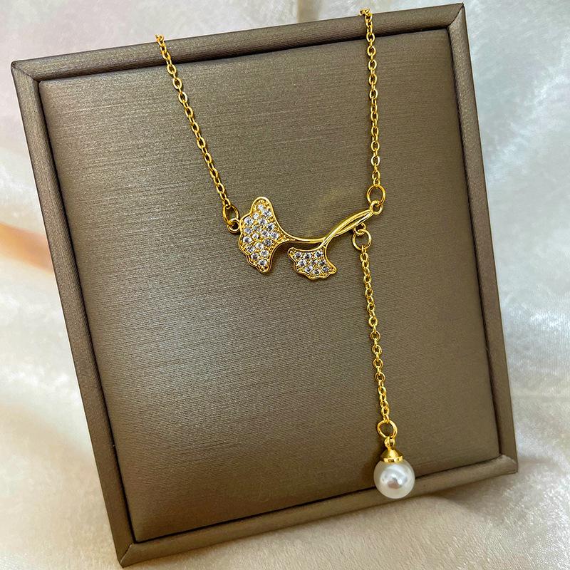 Позолоченная медь 18 карат, цепочка на ключицу с дизайном абака, тыквы-горлянки и лебедя.