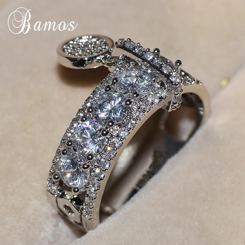 Массивное женское кольцо усыпанное кристаллами с подвеской