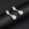 Imitation Pearl Jewelry Three-Piece Set An imitation pearl necklace A pair of faux pearl earrings