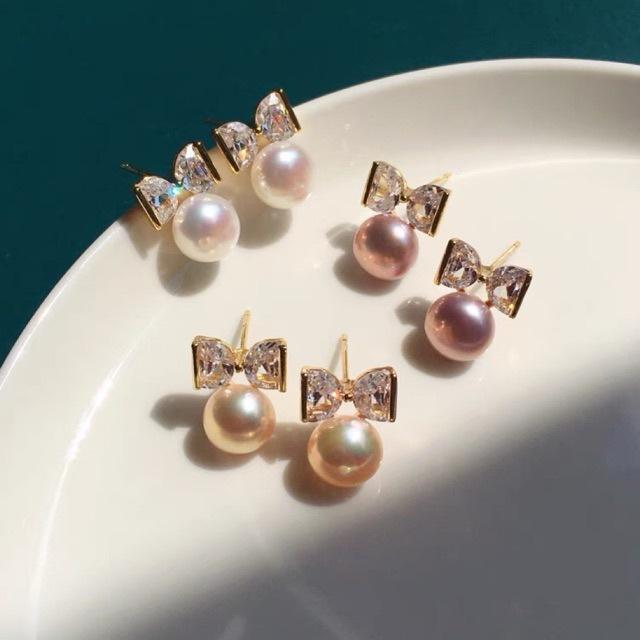 Bow natural freshwater pearl stud earrings women's light luxury high-end autumn and winter earrings new flashing zircon tide earrings