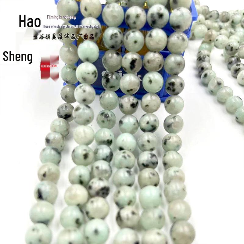 Бусины из натурального камня Тяньшаньский голубой 6-10 мм с черными пятнами для изготовления браслетов своими руками.