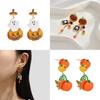 Whimsical Long Pumpkin Earrings For Halloween Featuring Cute Cartoon Characters In Alloy