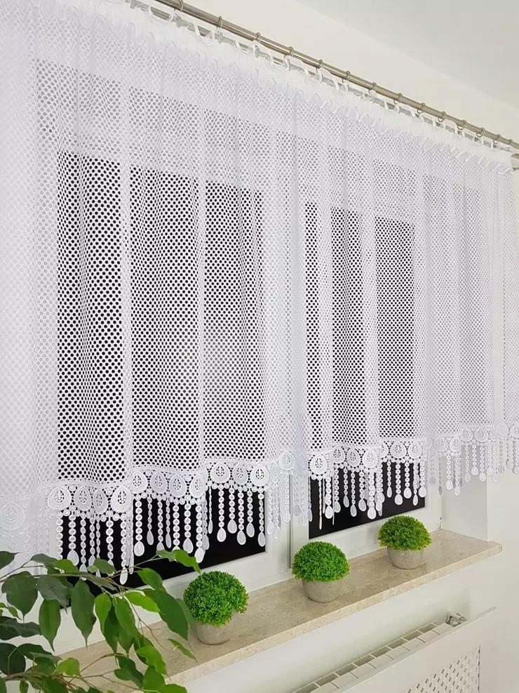 A short mesh curtain decorated with guipure lace