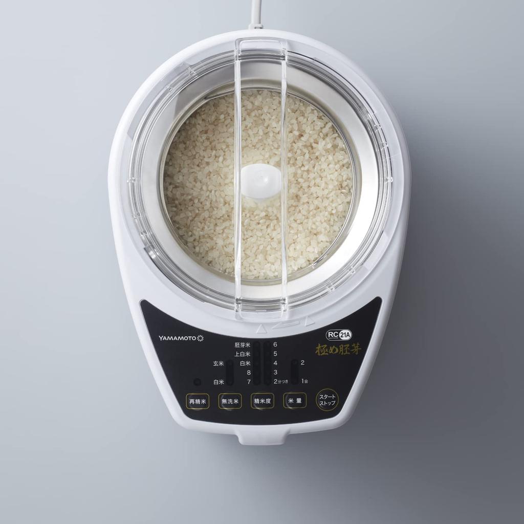 Электрическая домашняя шлифовальная машина для риса Yamamoto Ultimate Germ White разделяет рис на белую крупу и отруби, а модель YE-RC21A-WH шлифует рис и зародыши.