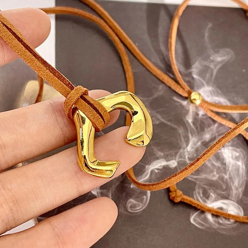 U-Shaped Horseshoe Metal Pendant Necklace Female Niche Design Coffee Colored Leather Rope Long Sweater Chain