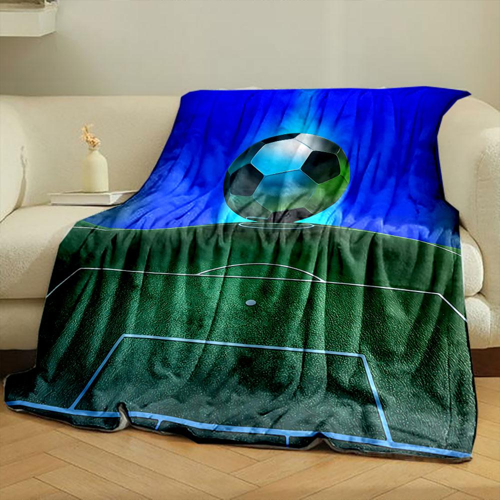 A soccer ball hovers above a green field with glowing blue background. for all seasons blanket lunch break throw gift