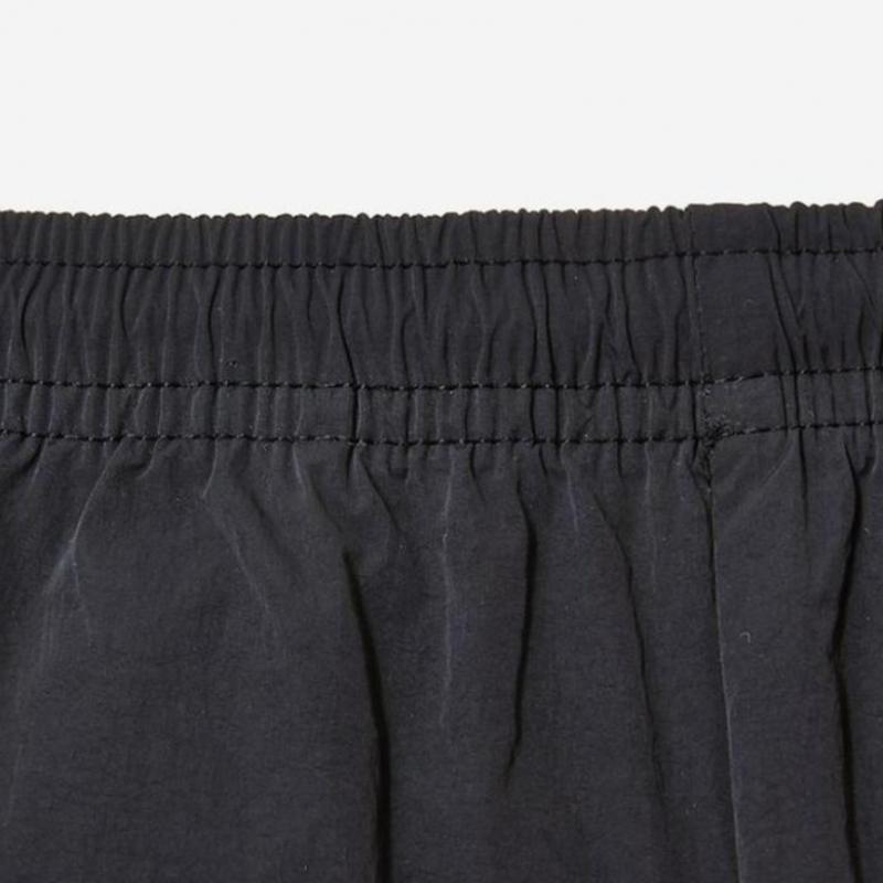 New Balance Унисекс Базовые нейлоновые брюки с логотипом Nbntc32703