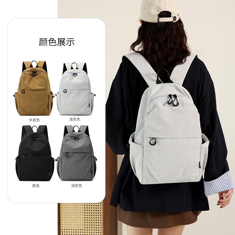 Schoolbag large-capacity new men's and women's backpacks, casual and lightweight student schoolbags, sports, short-distance travel backpacks