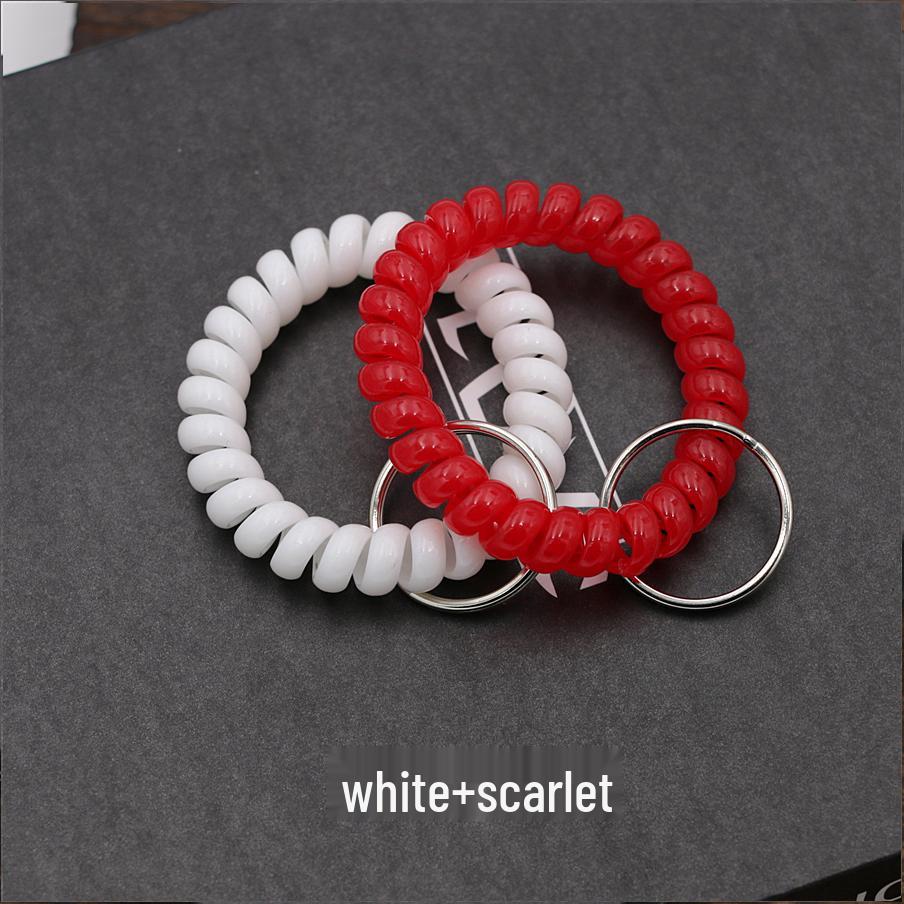 Минималистичный браслет-брелок и резинка для волос в виде пружинного механизма