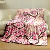 Pink cherry blossoms with brown branches and scattered petals on beige. for all seasons blanket lunch break throw gift
