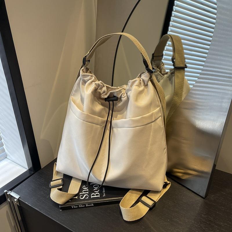 2024 New Japanese Solid Color One Shoulder Underarm Bag Folded Simple Drawstring Lightweight Casual Commuter Double Shoulder Bucket Bag