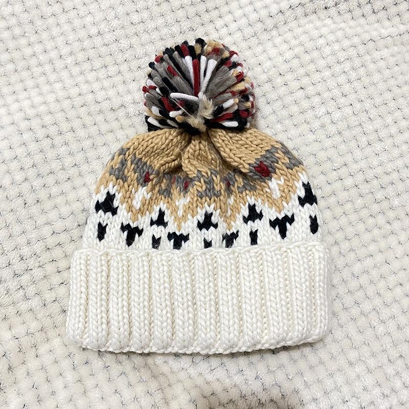 Hat women's autumn and winter warm ear protection wool hat versatile fashion cold hat age reduction cute hairball knitted hat tide