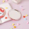 Круглое ручное зеркало Hello Kitty розового цвета
