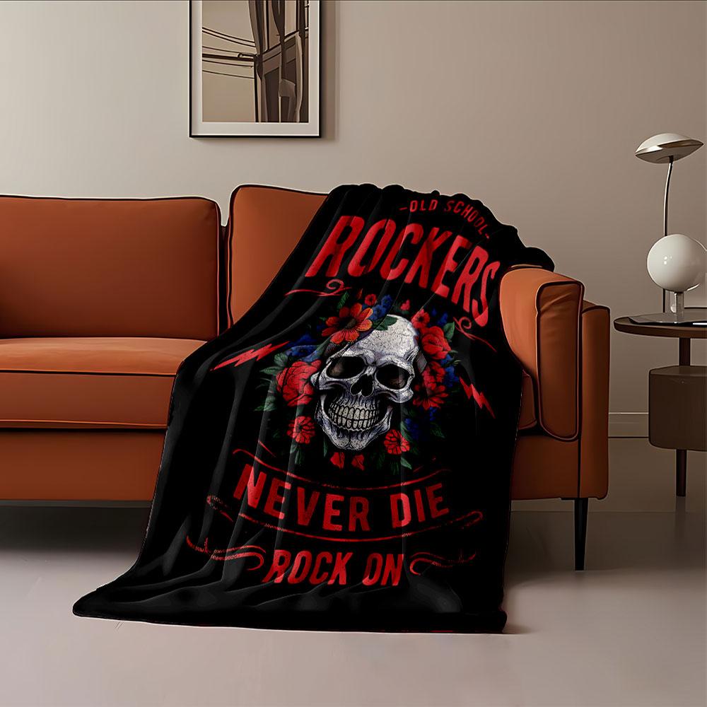 A skull surrounded by vibrant flowers and bold text with a rock theme. for all seasons blanket lunch break throw gift
