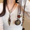 Chinese Zen Feather Necklace: Retro Ethnic Style Sweater Chain for Autumn & Winter