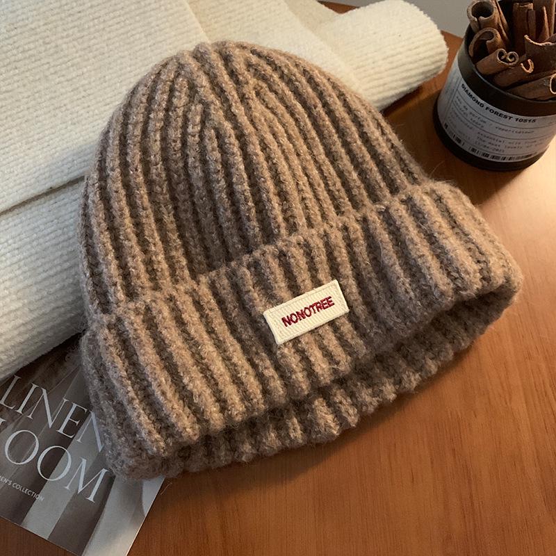 Женская вязаная шерстяная шапка синего цвета на осень/зиму 2024 года — свободный крой, утягивающий дизайн, теплая защита ушей