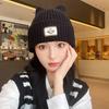 Autumn and winter new labeling cold hat versatile smiley face wool hat women's big head circumference ear protection warm hat thickened knitted hat