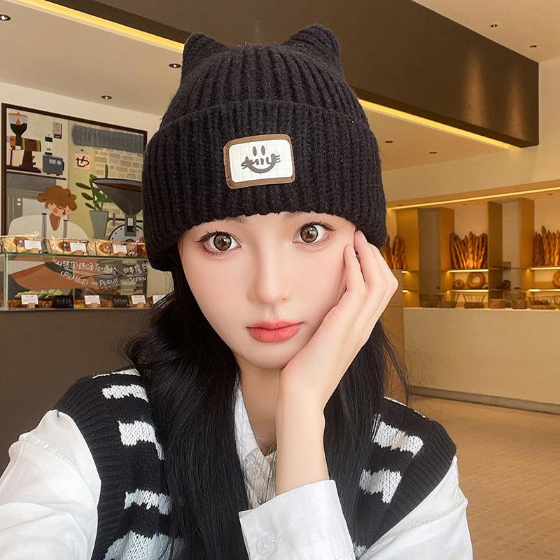 Autumn and winter new labeling cold hat versatile smiley face wool hat women's big head circumference ear protection warm hat thickened knitted hat