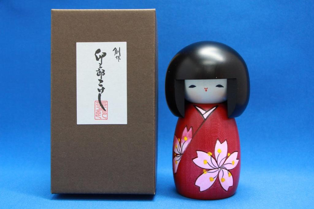 A popular souvenir from in Folk handcrafted Kokeshi doll by featuring cherry blossoms Japan! [Made Japan] craft, item Usaburo, (small size).