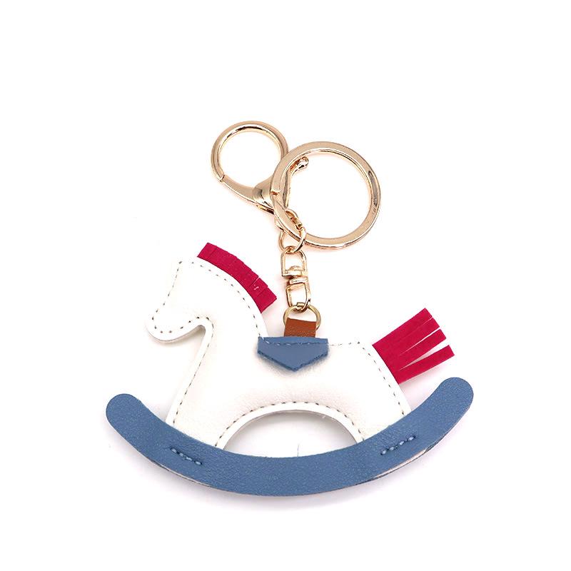 Cartoon Rocking Horse Keychain: Creative PU Leather Pony Charm with Cotton Filling.