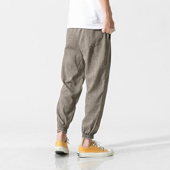 Весна Осень Мужские шаровары Шаровары Свободные завязывающиеся на шнурок эластичные карманы Глубокий шаговый шов с резинкой на щиколотке Однотонные спортивные брюки Повседневная одежда Спортивные брюки