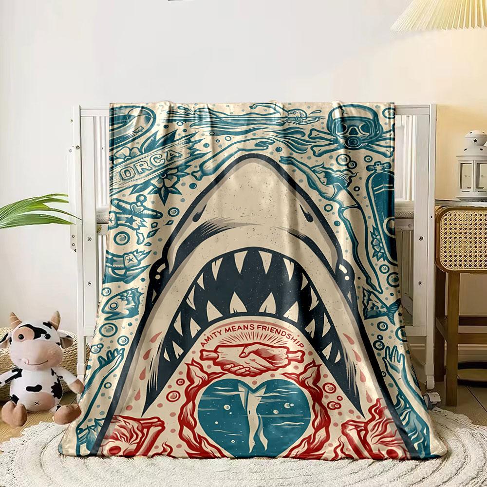 A shark with open jaws surrounded by ocean-themed illustrations and symbols. for all seasons blanket lunch break throw gift