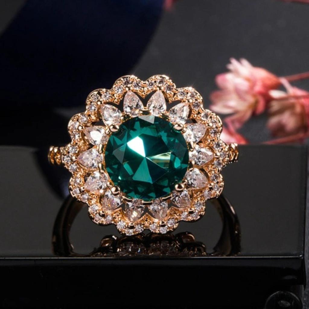 Elegant and exquisite large green round main stone ring for women, with marquise-shaped pavé floral halo, suitable for daily office wear, parties,
