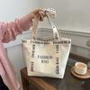 Большая вместительная переносная холщовая сумка женская весна 2024 года новая простая сумка через плечо с буквенным принтом повседневная сумка-тоут для поездок на работу