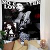 A monochrome collage featuring a singer, text, stars, and vinyl record graphic. Patterned tapestry for bedroom and living room home decor