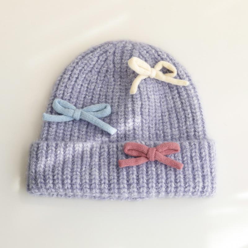 Вязаная шерстяная шапка с бантом для женщин на осень и зиму, теплая и универсальная, утолщенная защита ушей, шапка, подчеркивающая маленькое лицо
